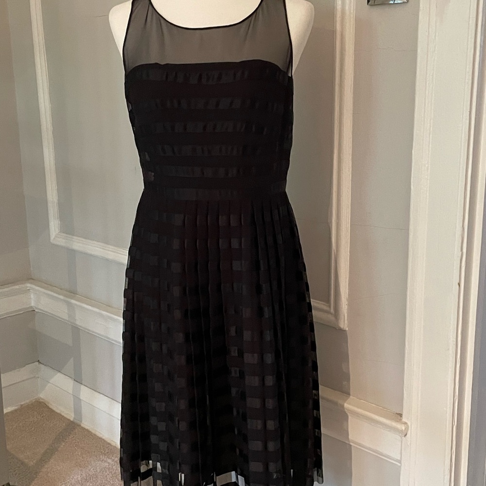 Calvin Klein dress with pleated skirt and sheer top.